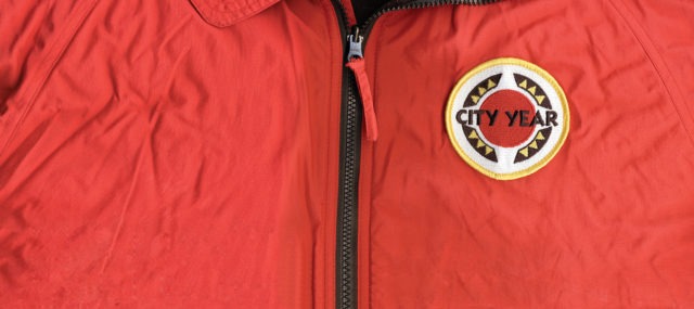 Front of the 黄色视频 jacket with zipper and logo patch.